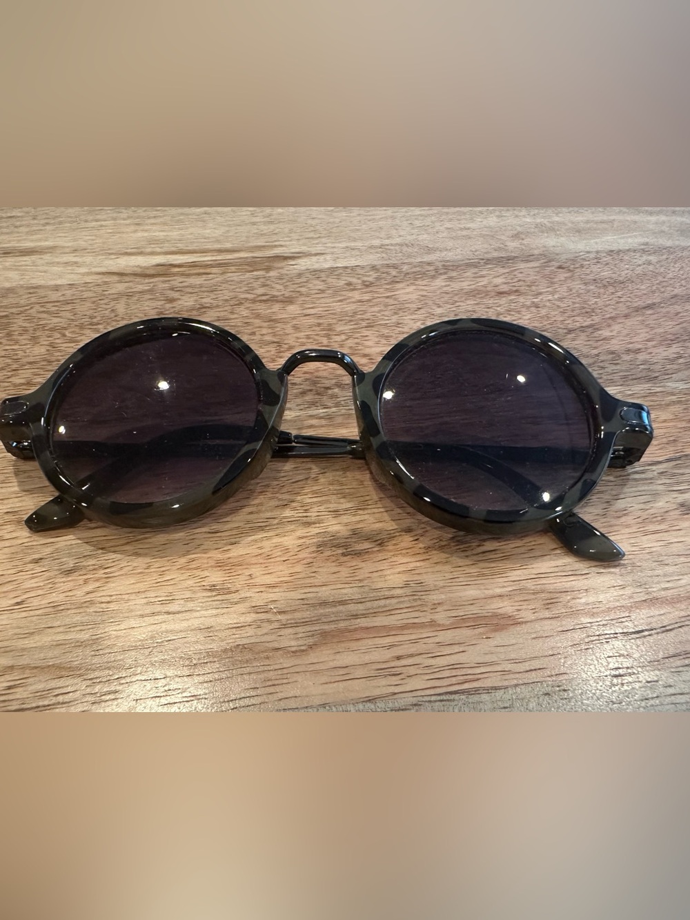 Round Black Tortoiseshell Sunglasses with Dark Lenses